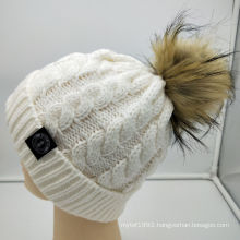 Guangzhou beanie hat manufacturer 2020 new arrival custom women beanie hat cable knit warm winter hat with plush fur ball